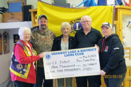 Sharbot Lake & District Lions present cheques to the Central Frontenac Rec Committees. R to L: Dawn Hansen, Cory Thompson, Wanda Harrison, Bob Teal, Leslie Merrigan